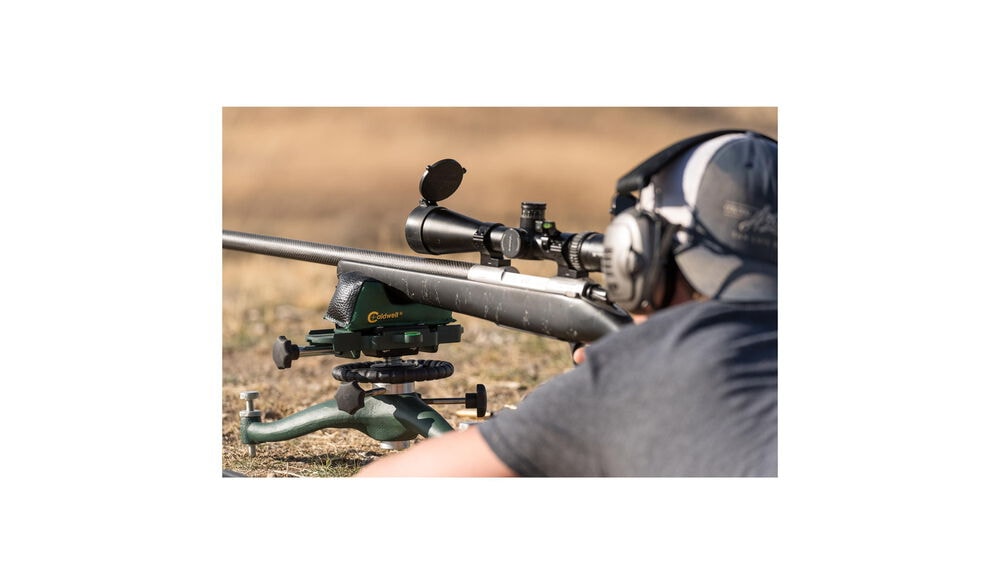 440907-110041-with_rifle-outside-at_range-back_vie