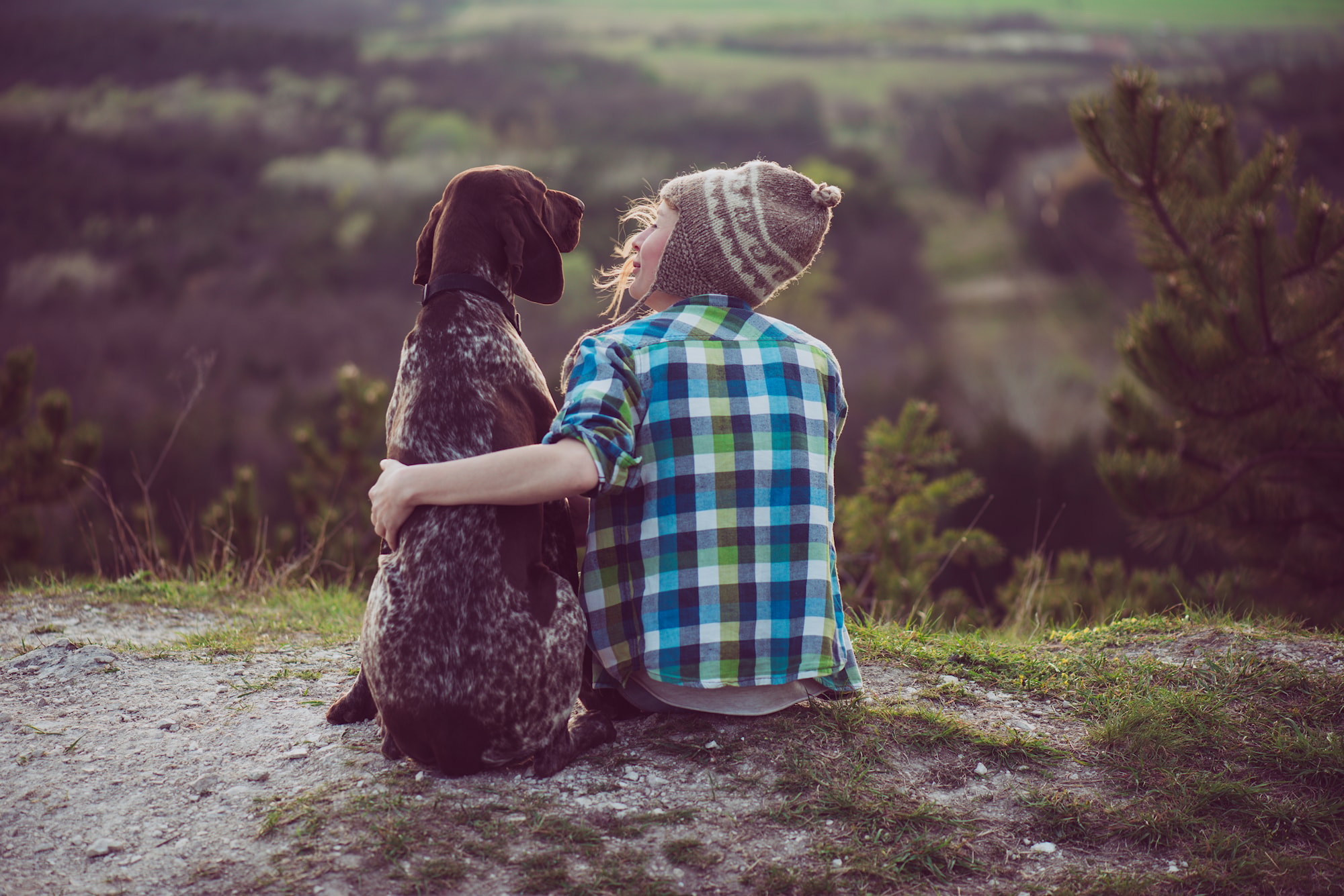 Womanandherdogposingoutdoor.Girllovingandhuggingti